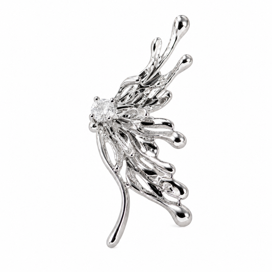 A silver-toned wing-shaped earring featuring a clear round-cut center stone and delicate leaf-like extensions, shown on a plain white background.