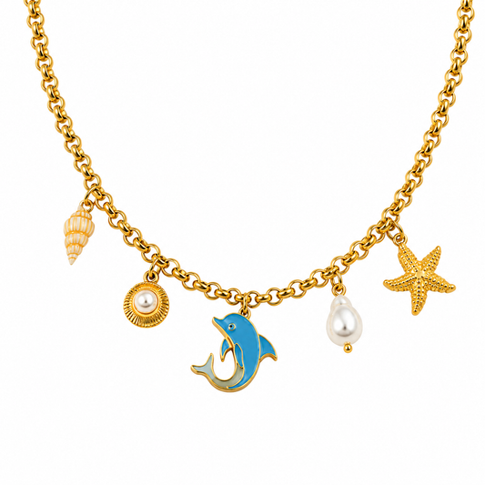A gold chain necklace with ocean-themed charms, including a blue dolphin, a starfish, a seashell, a pearl shell, and a pearl drop, shown on a plain white background.