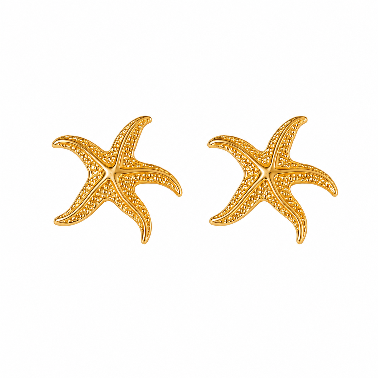 A pair of gold starfish stud earrings with textured pavé detailing, shown on a plain white background.