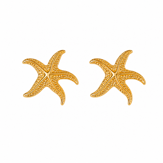 A pair of gold starfish stud earrings with textured pavé detailing, shown on a plain white background.