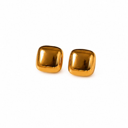 A pair of square stud earrings with rounded corners, featuring a polished metallic gold finish, shown on a plain white background.