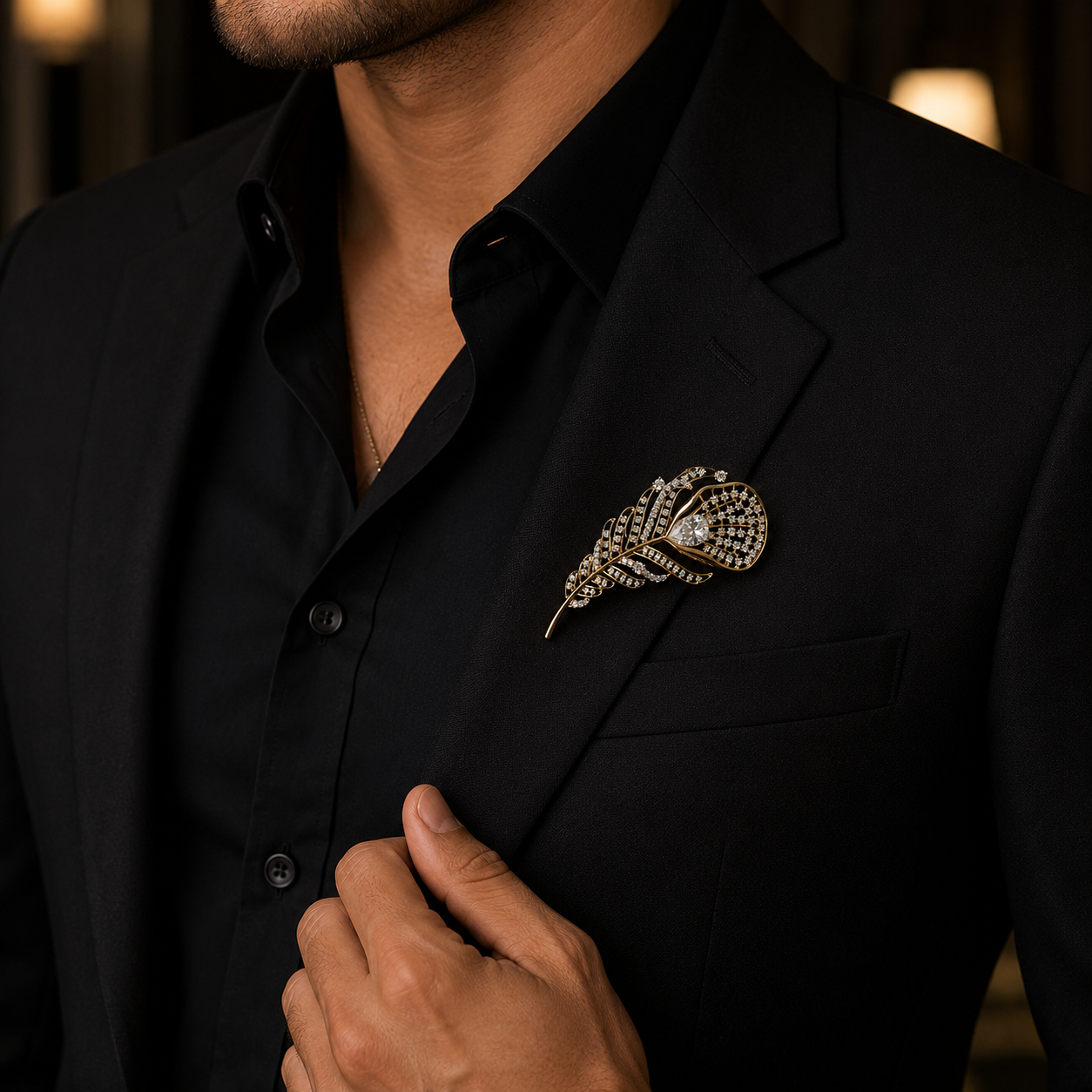 Person wearing a black suit with a decorative brooch on a blurred background