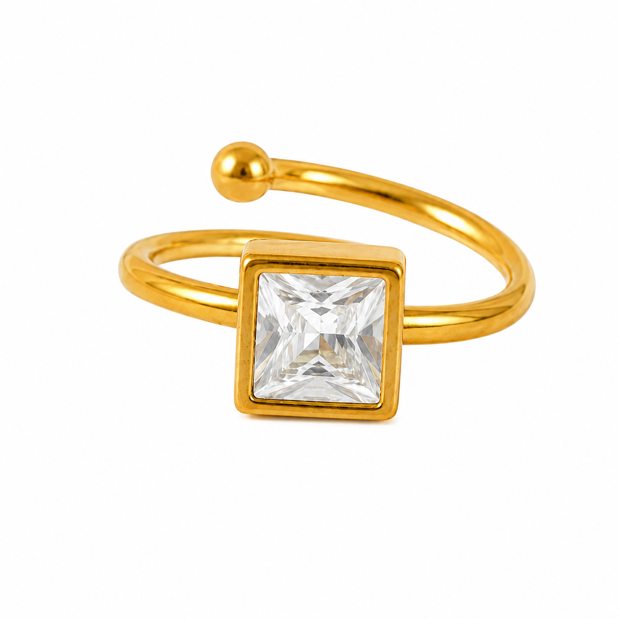 A gold-plated open band ring featuring a square bezel-set clear crystal gemstone, shown on a plain white background.